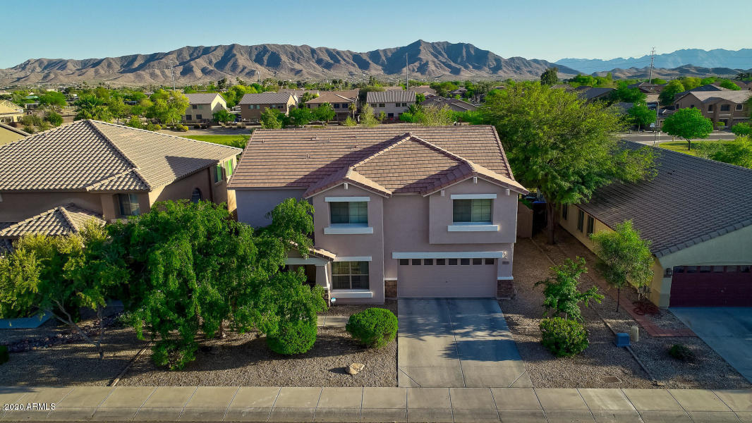 2917 West Fremont Rd. Phoenix, AZ 85041 - Photo 6 of 41 an aerial view of a house with a yard and a large tree