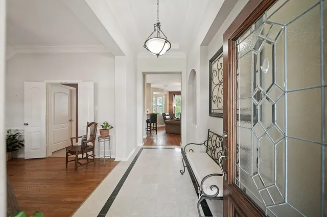 a view of a room with furniture and wooden floor