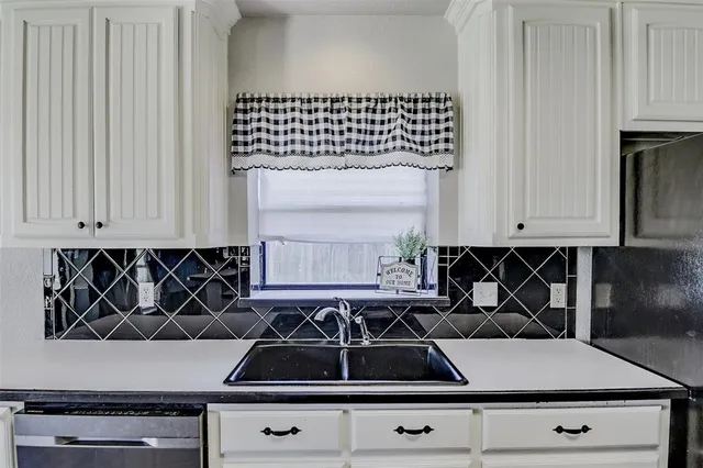 a close view of a stove top oven sitting inside of a kitchen