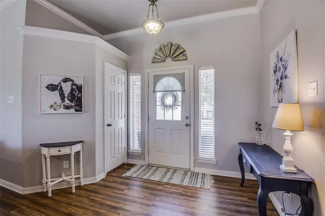 a view of a livingroom with furniture and wooden floor