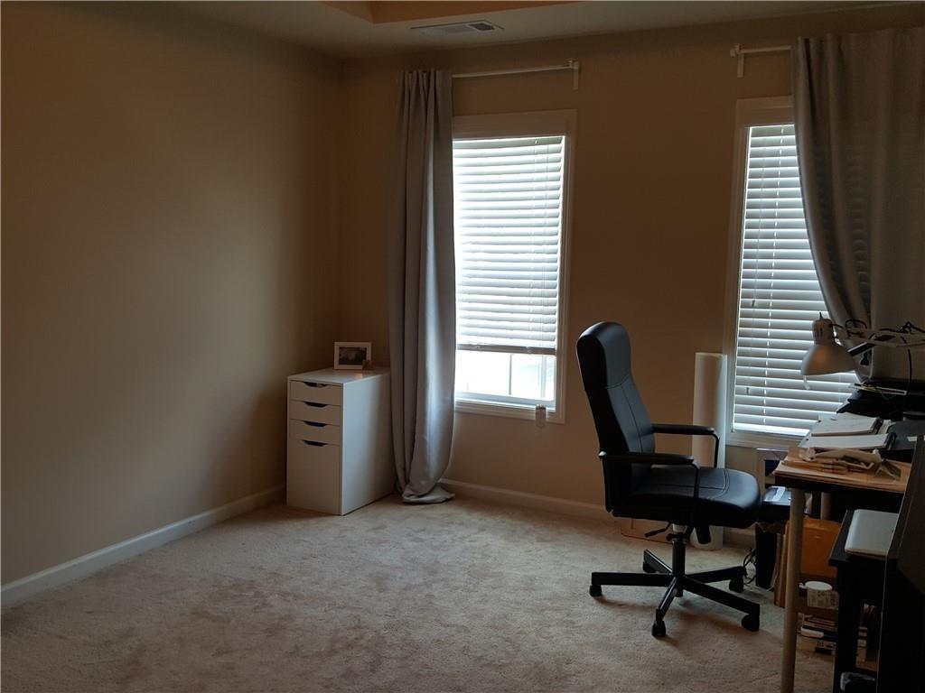 805 Pleasant Hill Road, Unit 330 Lilburn, GA 30047 - Photo 18 of 24 a view of a workspace with furniture and a window