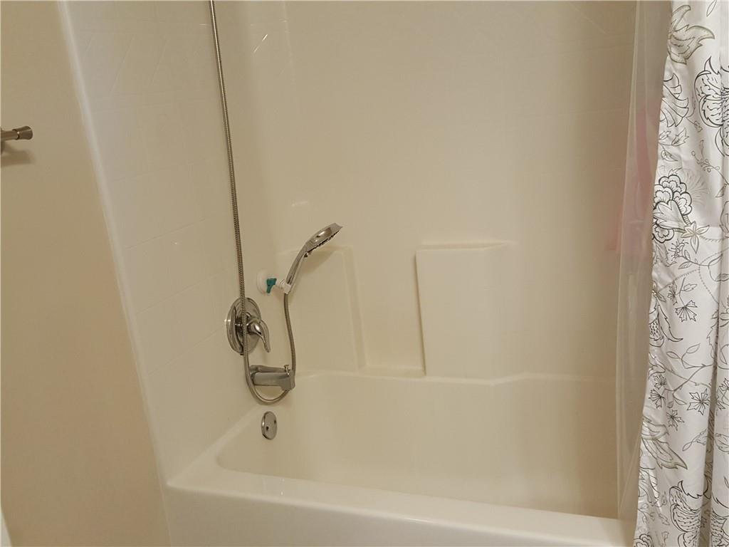 805 Pleasant Hill Road, Unit 330 Lilburn, GA 30047 - Photo 20 of 24 a bathroom with a shower