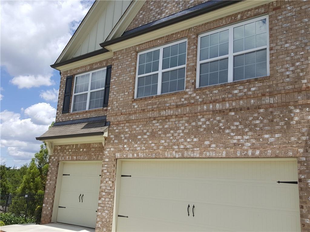 805 Pleasant Hill Road, Unit 330 Lilburn, GA 30047 - Photo 2 of 24 a front view of a building with many windows
