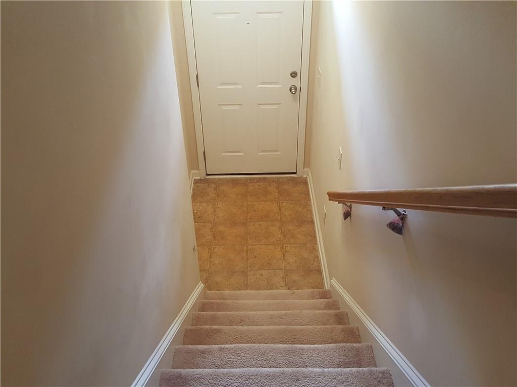 805 Pleasant Hill Road, Unit 330 Lilburn, GA 30047 - Photo 6 of 24 a view of staircase with white walls