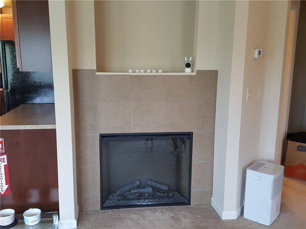 805 Pleasant Hill Road, Unit 330 Lilburn, GA 30047 - Photo 10 of 24 a view of an empty room with a fireplace