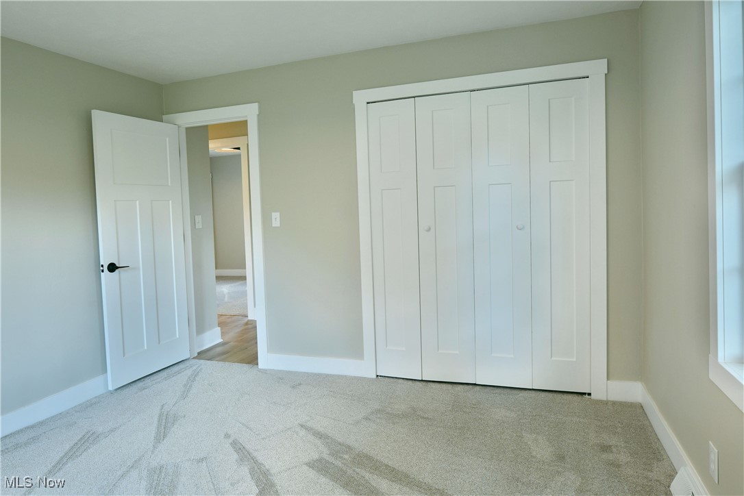 7655 Connelly Road Masury, OH 44438 - Photo 39 of 46 Unfurnished bedroom featuring carpet and a closet