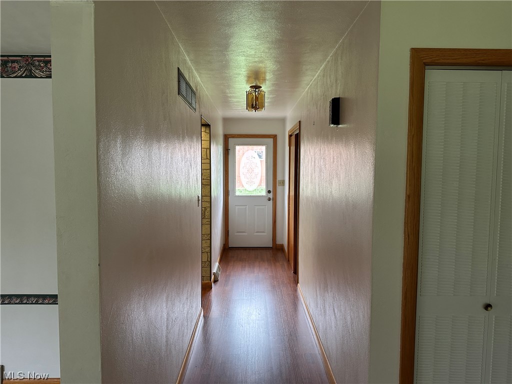 62273 Tacoma Road Barnesville, OH 43713 - Photo 16 of 34 Hallway with wood-type flooring
