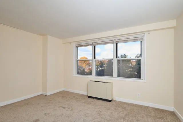 an empty room with a large window