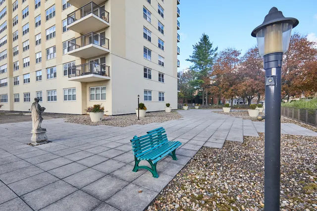 a pathway of a house with a yard