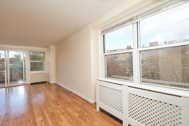 a view of a room that has a large window