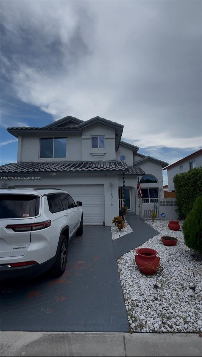 14716 Southwest 111th Terrace Miami, FL 33196 - Photo 1 of 30 a kitchen with furniture and a fireplace