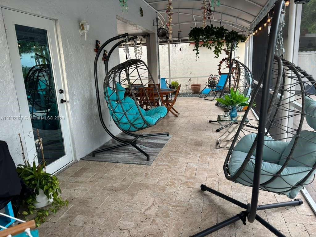 14716 Southwest 111th Terrace Miami, FL 33196 - Photo 12 of 30 a living room with furniture and a mirror