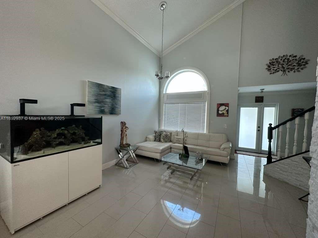 14716 Southwest 111th Terrace Miami, FL 33196 - Photo 13 of 30 a living room with furniture and a window