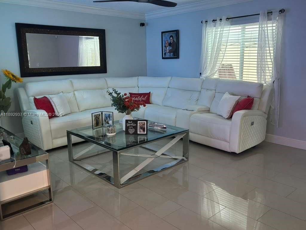 14716 Southwest 111th Terrace Miami, FL 33196 - Photo 16 of 30 a living room with furniture and a flat screen tv