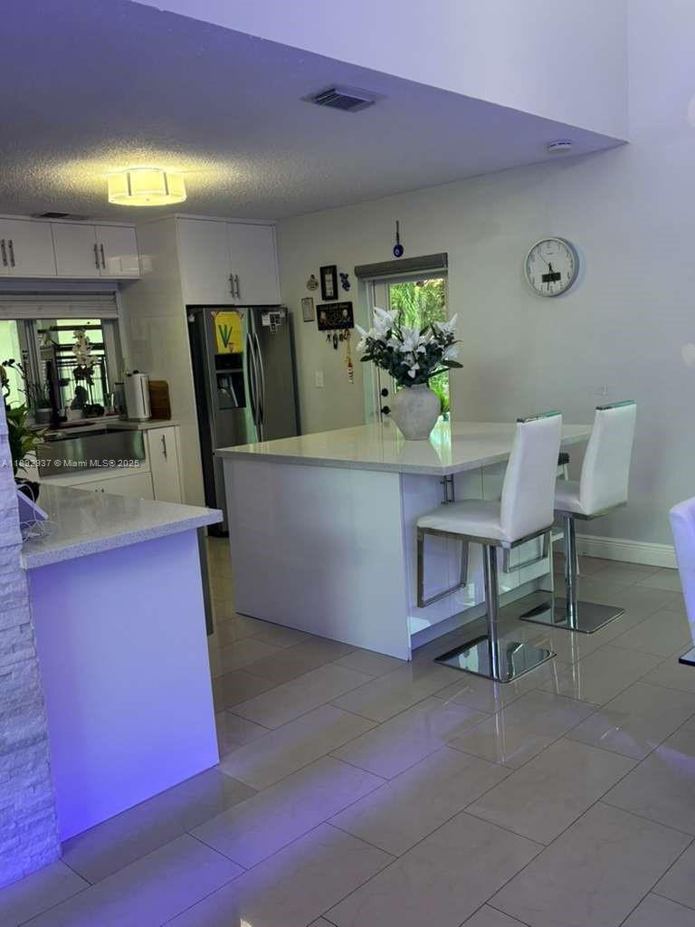 14716 Southwest 111th Terrace Miami, FL 33196 - Photo 17 of 30 a living room with furniture and a wooden floor
