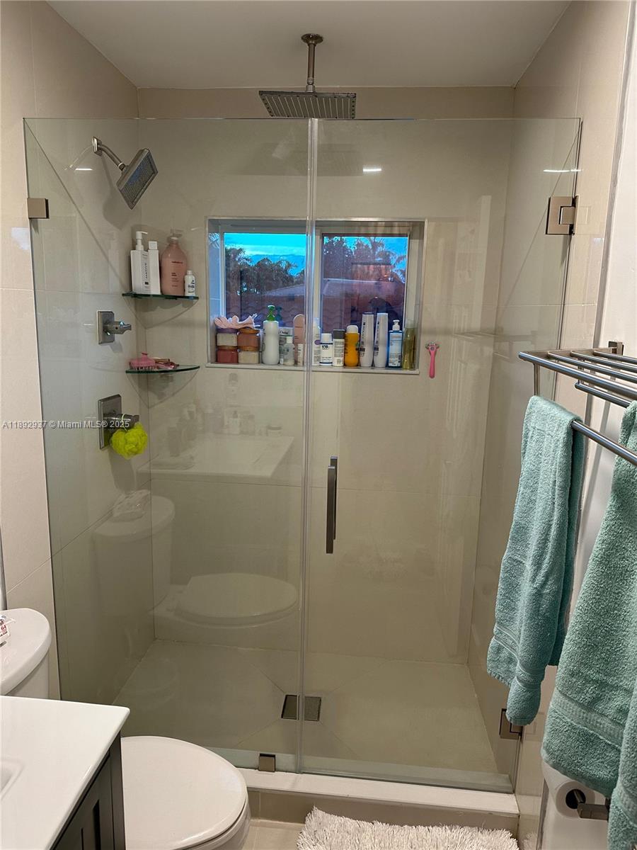 14716 Southwest 111th Terrace Miami, FL 33196 - Photo 22 of 30 a bathroom with a shower and a toilet