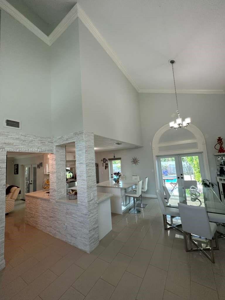 14716 Southwest 111th Terrace Miami, FL 33196 - Photo 29 of 30 a view of a living room and chandelier or kitchen