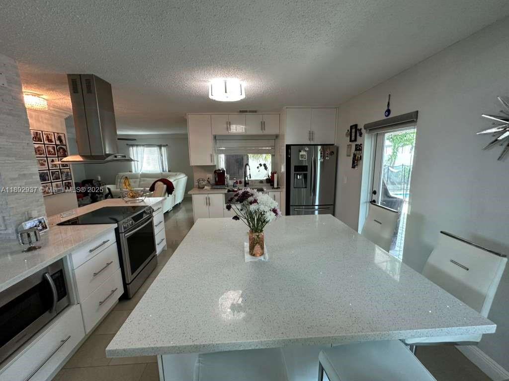 14716 Southwest 111th Terrace Miami, FL 33196 - Photo 4 of 30 a kitchen with lots of counter top space