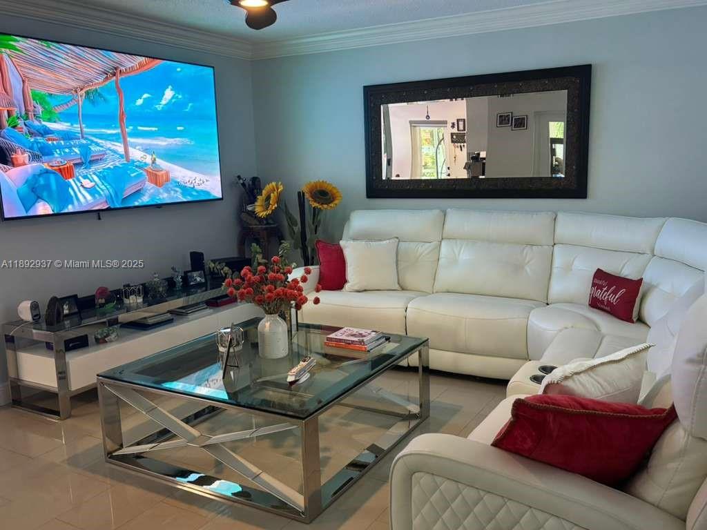 14716 Southwest 111th Terrace Miami, FL 33196 - Photo 9 of 30 a living room with furniture and a flat screen tv