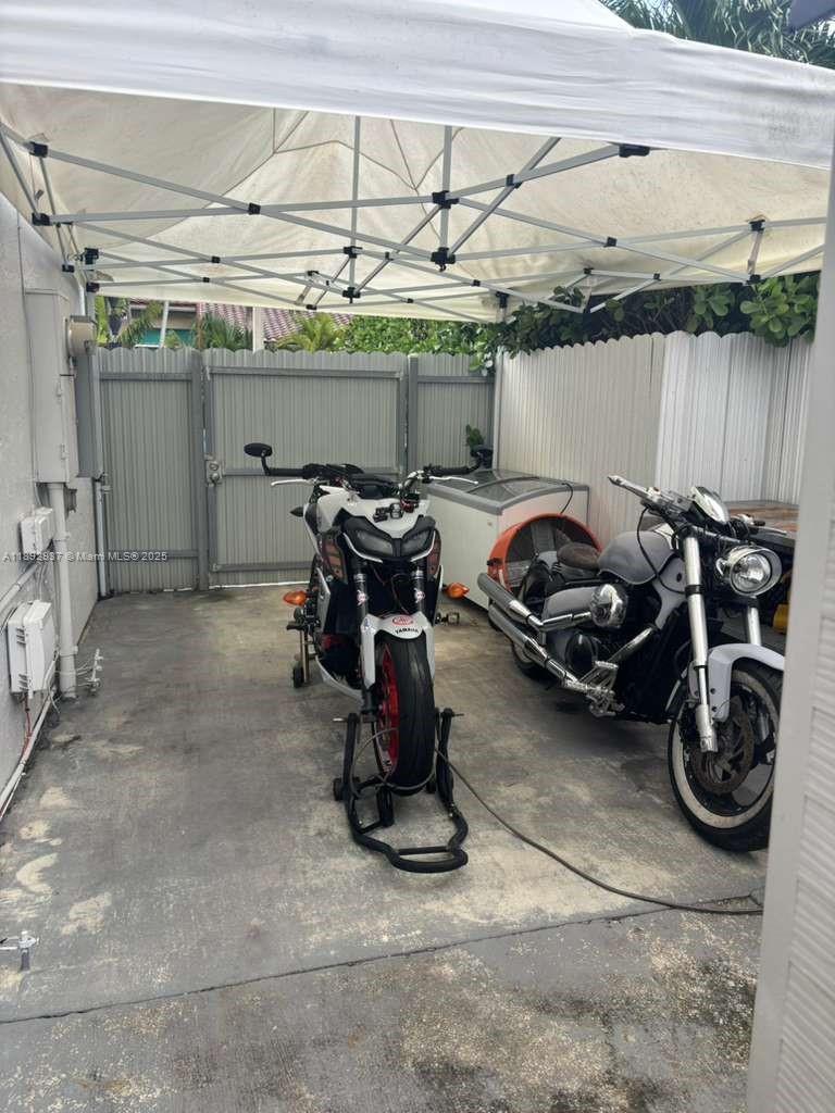 14716 Southwest 111th Terrace Miami, FL 33196 - Photo 10 of 30 a view of a garage with a car parked in it