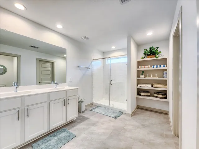 a shelf with a vase of flowers on it