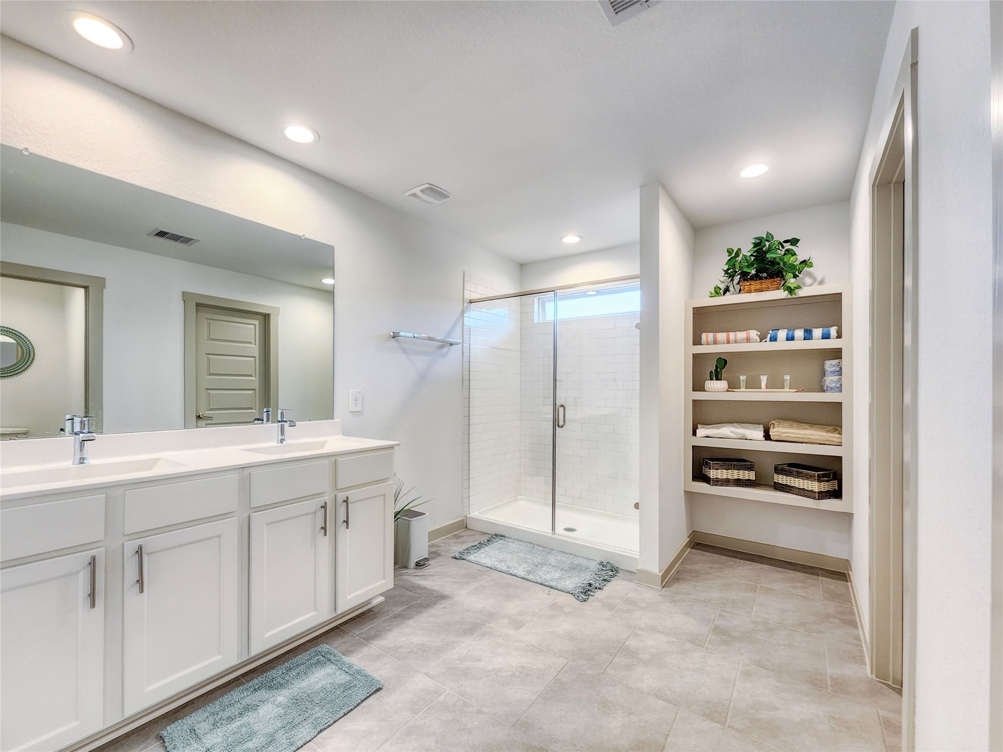 29914 Reagans Rnch Drive Katy, TX 77494 - Photo 36 of 45 a spacious bathroom with a shower a sink and a mirror