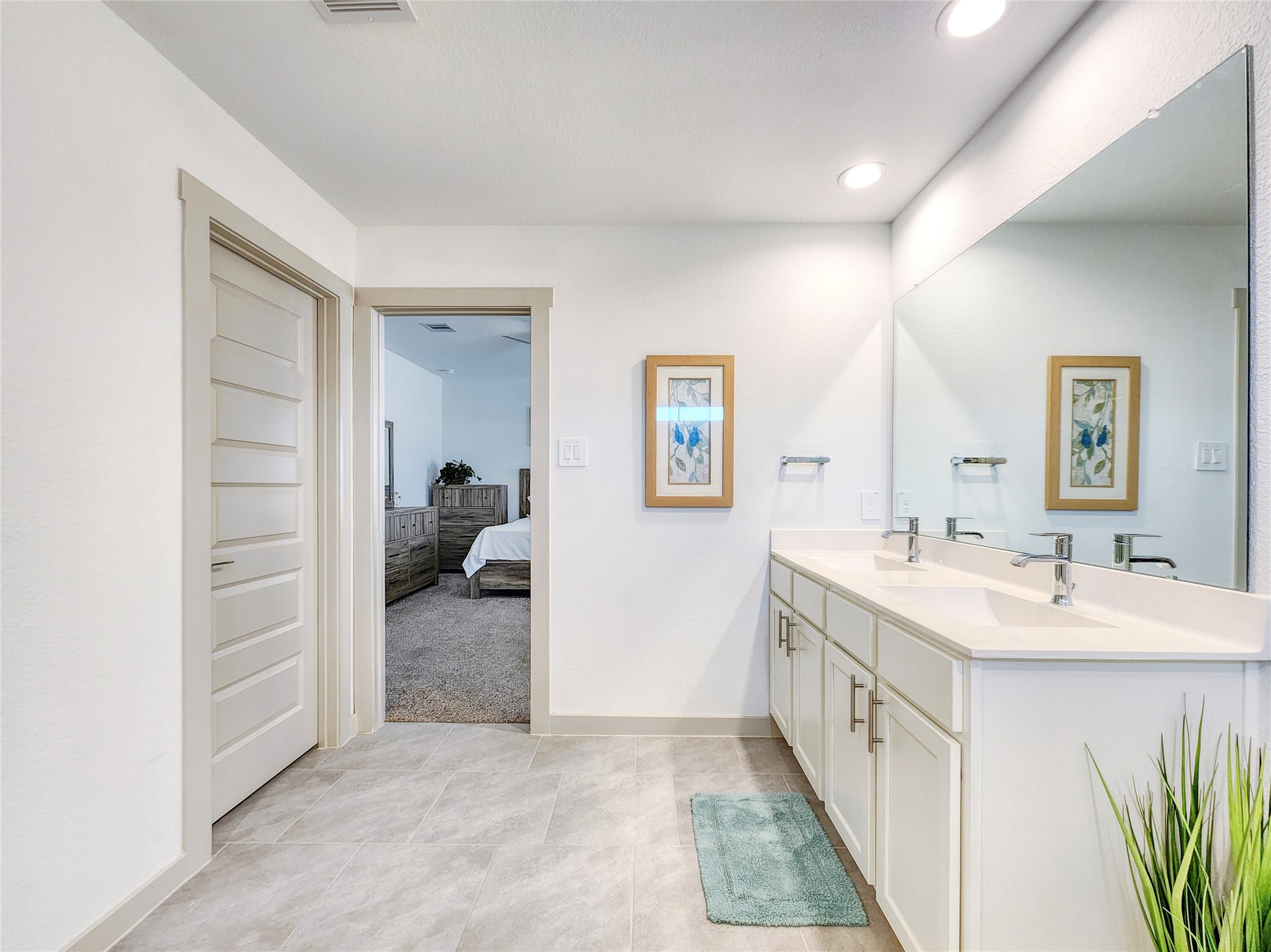 29914 Reagans Rnch Drive Katy, TX 77494 - Photo 41 of 45 a en suite bathroom with a double vanity sink and a mirror