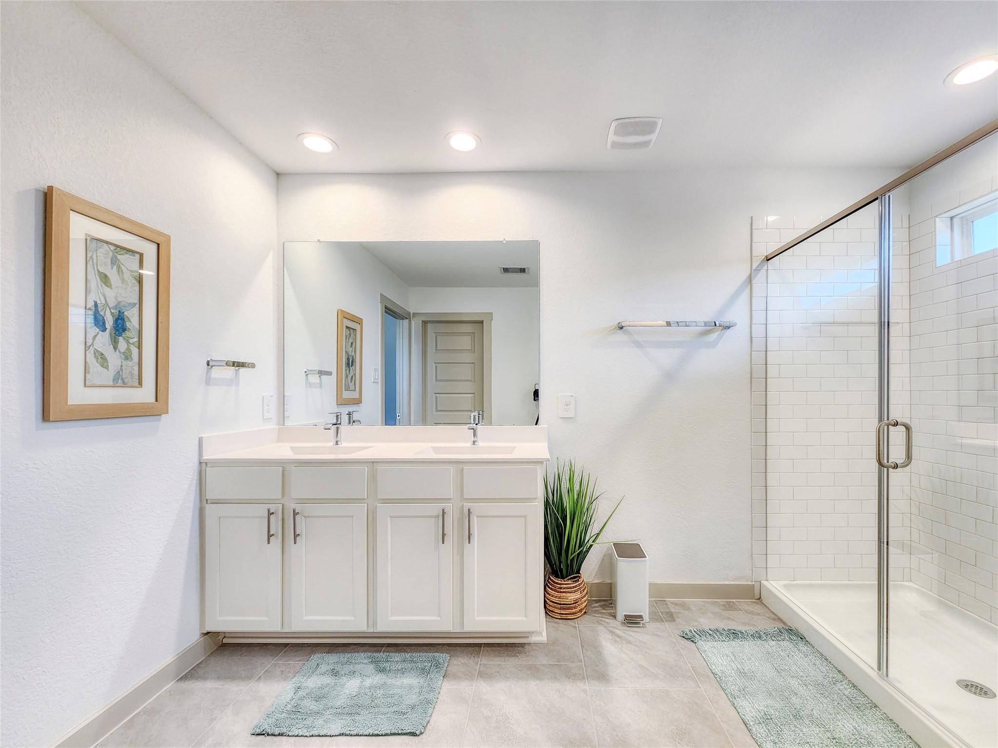 29914 Reagans Rnch Drive Katy, TX 77494 - Photo 42 of 45 a spacious bathroom with a shower sink and mirror