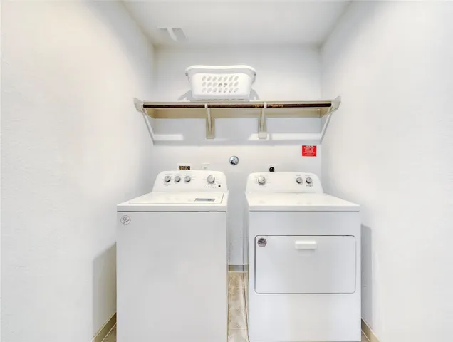 a view of a livingroom with furniture and white walls