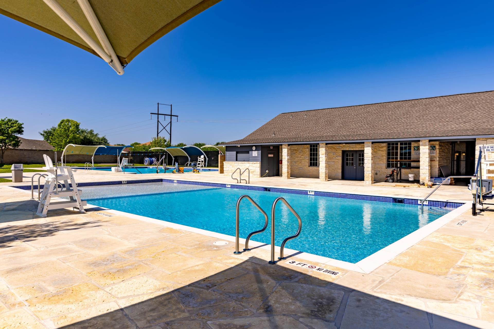 400 Blue Shale Drive Jarrell, TX 76537 - Photo 22 of 22 a view of a house with pool and chairs
