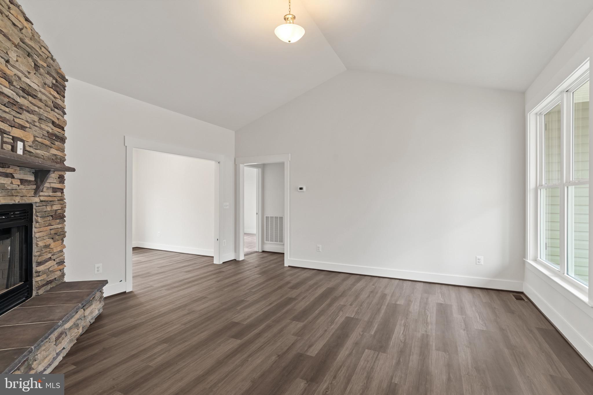 6735 Beverly Road Broad Run, VA 20137 - Photo 7 of 30 Unfurnished living room featuring a fireplace, lof