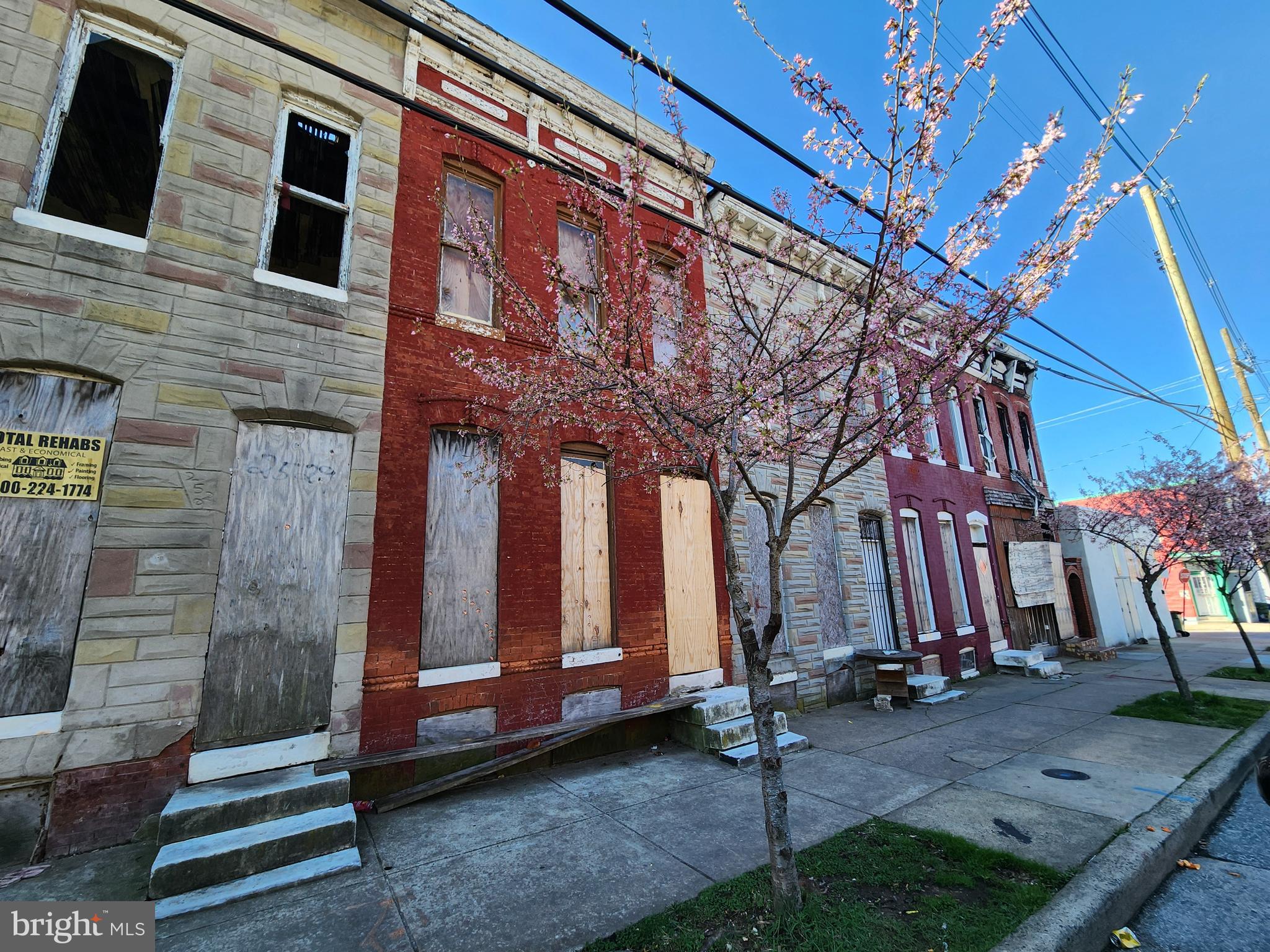2527 East Oliver Street Baltimore, MD 21213 - Photo 4 of 4 a view of brick house with large windows