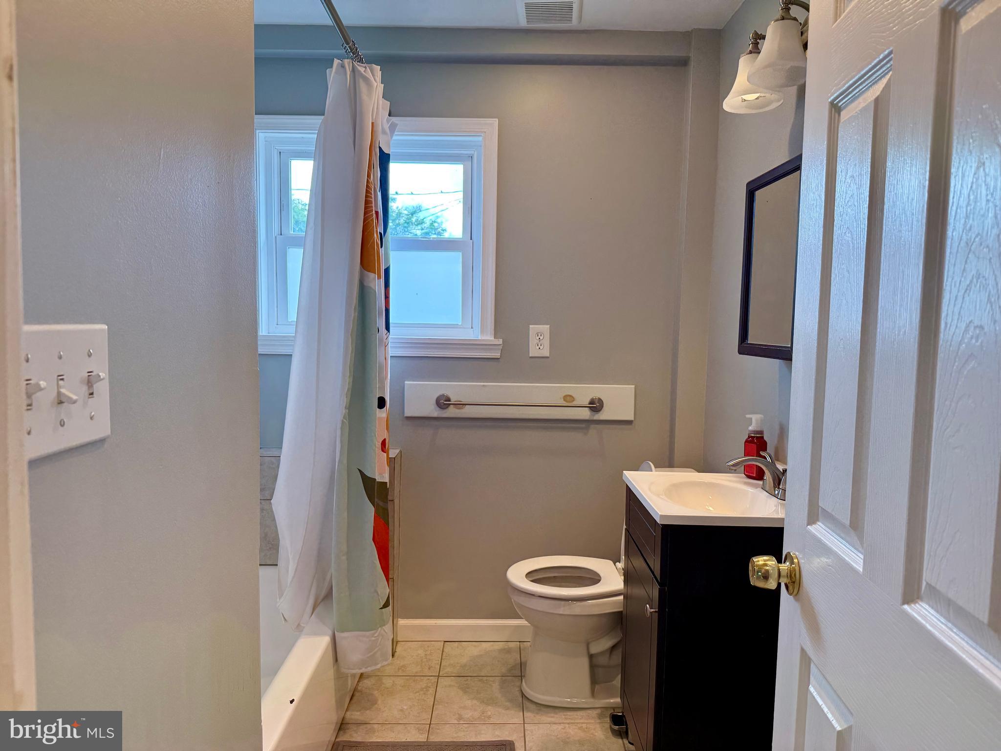16 Portship Road Baltimore, MD 21222 - Photo 14 of 21 a bathroom with a toilet sink and mirror