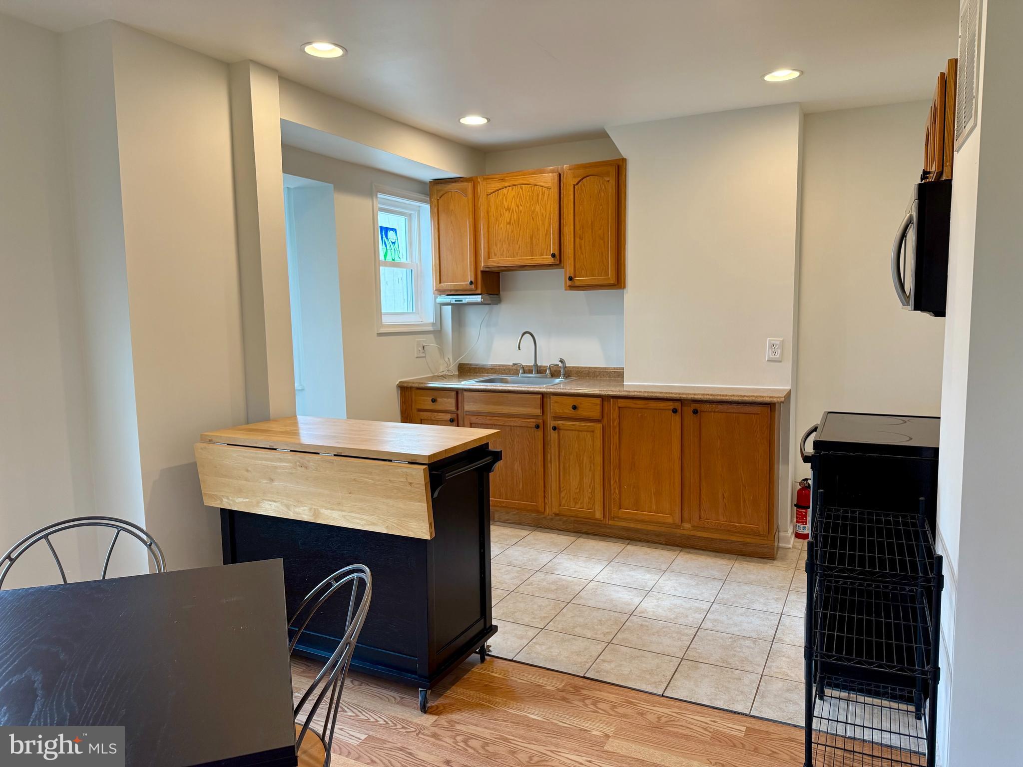 16 Portship Road Baltimore, MD 21222 - Photo 5 of 21 a kitchen with stainless steel appliances granite countertop a sink counter space and cabinets