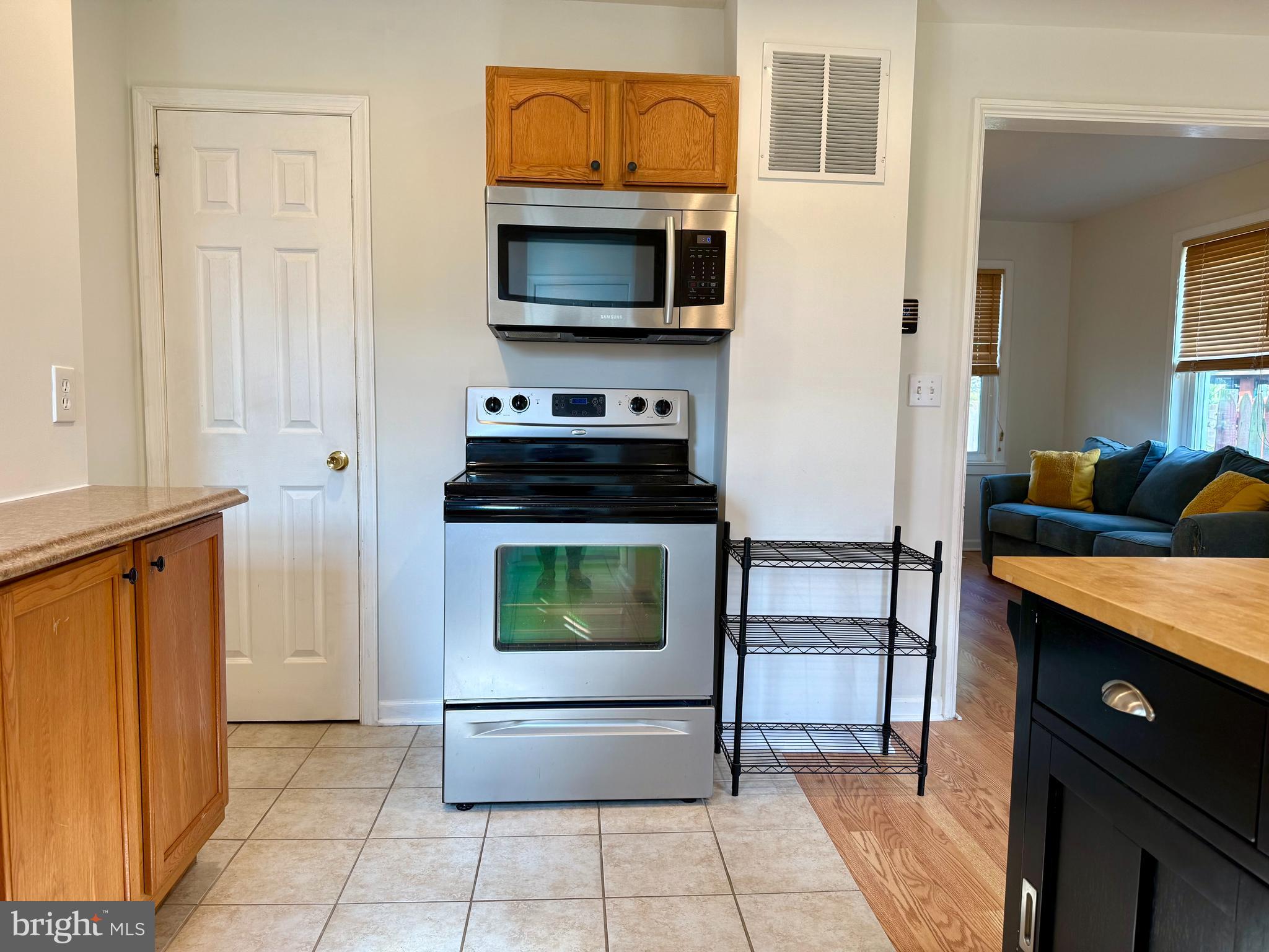 16 Portship Road Baltimore, MD 21222 - Photo 9 of 21 a kitchen with a stove and a microwave