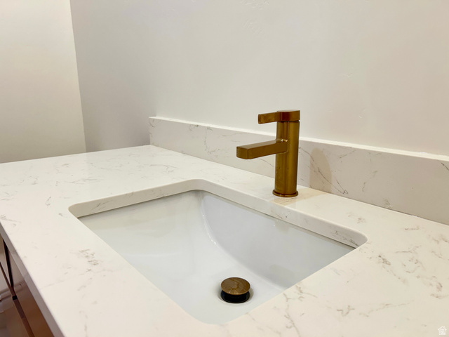 6 South 450th West Gunnison, UT 84634 - Photo 21 of 45 Integrated vanity sink with a white basin and a brass-finish faucet