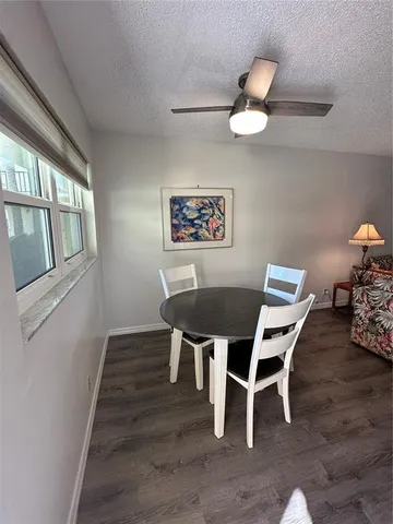 a bedroom with a bed and a mirror