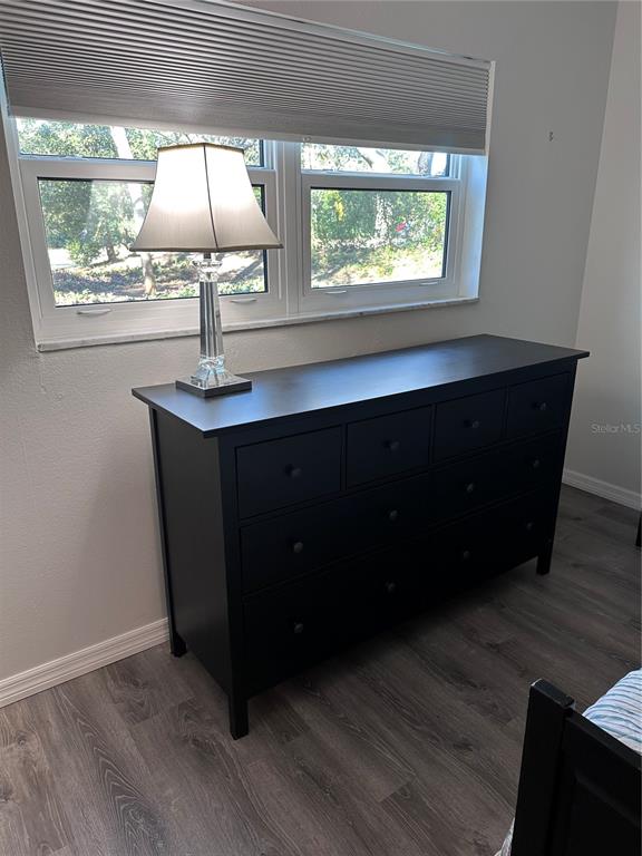 11485 Oakhurst Road, Unit 200114 Largo, FL 33774 - Photo 18 of 40 a kitchen with a sink a window and wooden floor