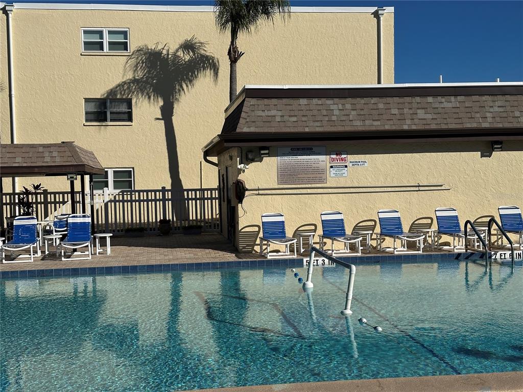 11485 Oakhurst Road, Unit 200114 Largo, FL 33774 - Photo 27 of 40 a view of house with outdoor seating
