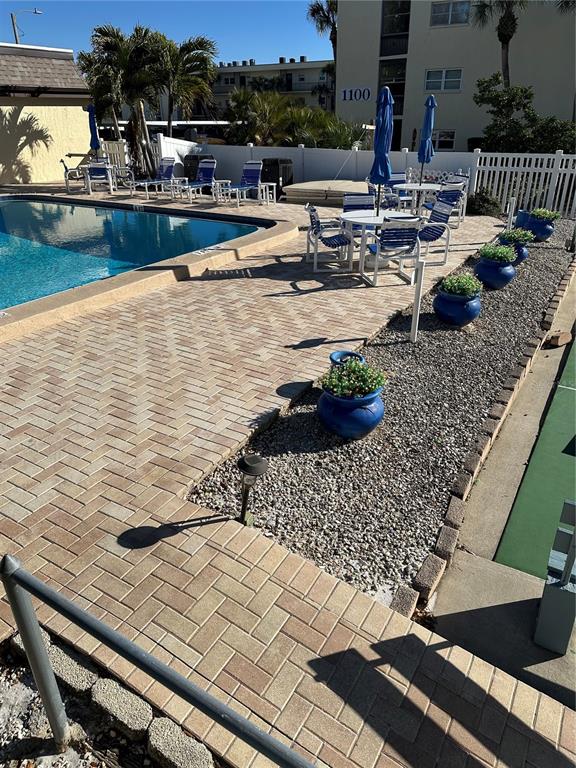 11485 Oakhurst Road, Unit 200114 Largo, FL 33774 - Photo 28 of 40 a view of swimming pool with outdoor seating