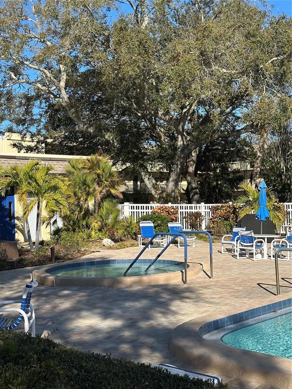 11485 Oakhurst Road, Unit 200114 Largo, FL 33774 - Photo 29 of 40 a view of a park with swings and slides