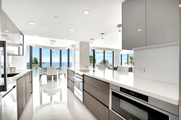 a large kitchen with lots of counter space and a table