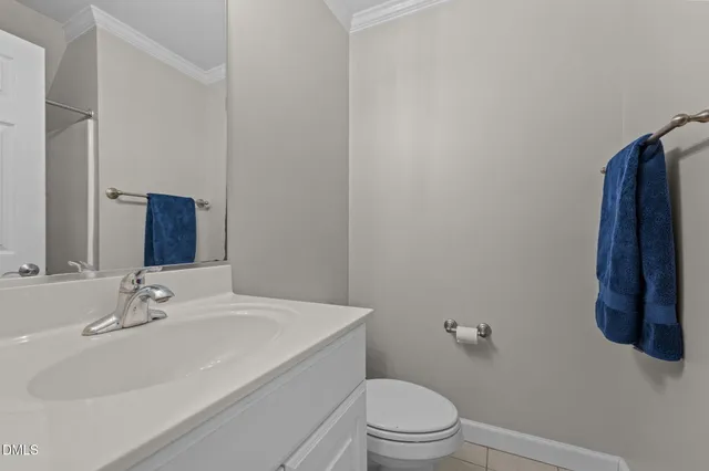 a bathroom with a sink toilet and vanity