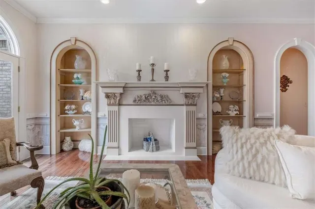 a living room with furniture and a lamp