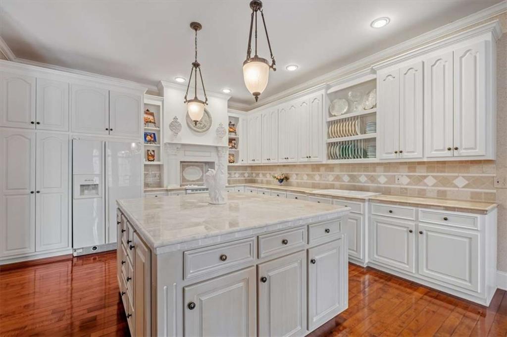 96 Windchime Way Northeast Rome, GA 30161 - Photo 15 of 57 a kitchen with cabinets stainless steel appliances a sink and a window