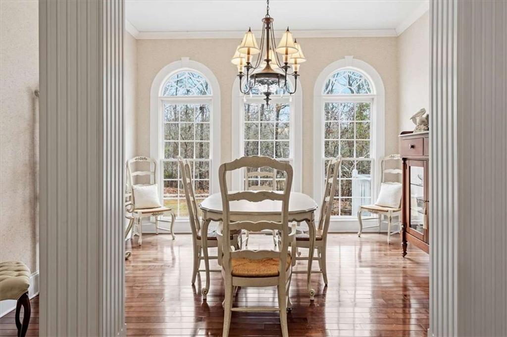 96 Windchime Way Northeast Rome, GA 30161 - Photo 19 of 57 a front view of a livingroom with a dining table & chairs