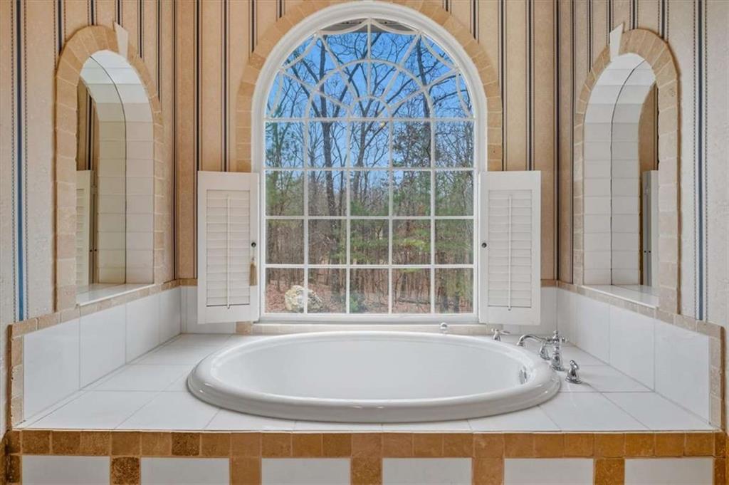 96 Windchime Way Northeast Rome, GA 30161 - Photo 33 of 57 a bath tub sitting next to a window
