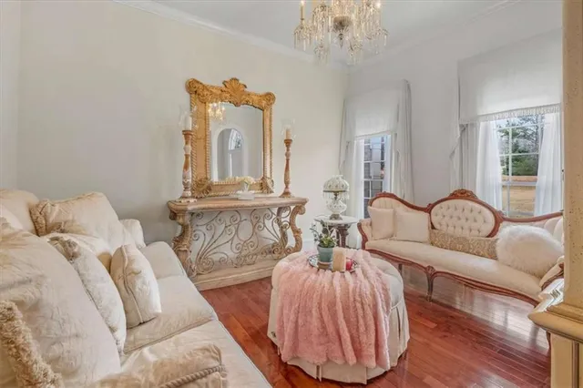 a bedroom with furniture and a mirror