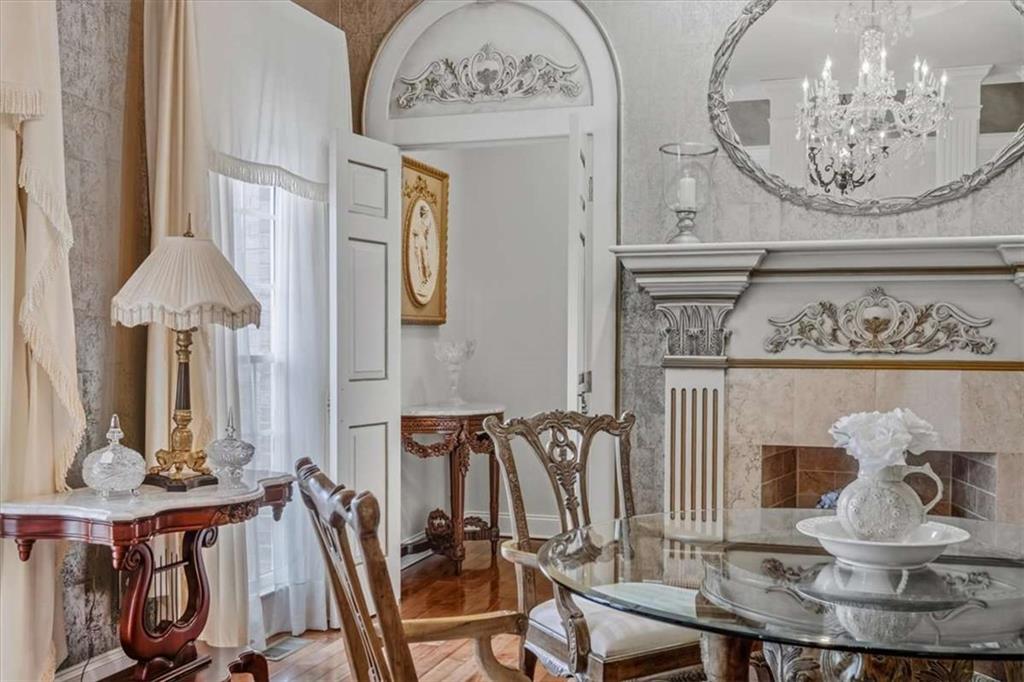 96 Windchime Way Northeast Rome, GA 30161 - Photo 43 of 57 a view of a dining room with furniture and a chandelier