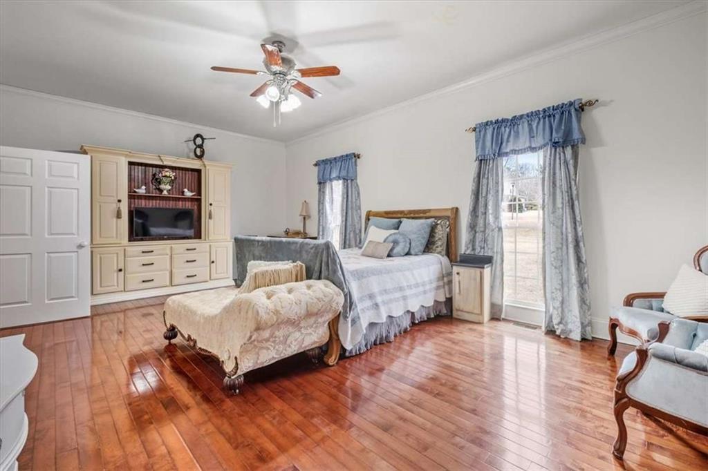 96 Windchime Way Northeast Rome, GA 30161 - Photo 50 of 57 a bedroom with a bed window and a table